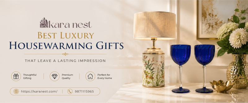 Luxury housewarming gift collection featuring premium glassware, designer table lamp, decorative vase, elegant serving accessories, premium sculptures, and modern luxury home décor styling.